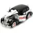   Jada Toys - Monopoly: 1939 Chevrolet Master Deluxe fém játékautó 20cm Mr. Monopoly figurával